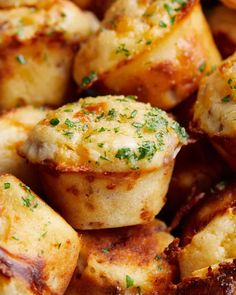 close up view of cooked potatoes with parsley on top and seasoning in the middle