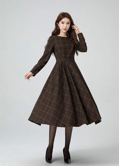 This garment blends timeless elegance with contemporary flair. The cinched waist and flared shape accentuates the waist, and there are pleated details at the waist. The plaid design adds a touch of vintage and sophistication.A must-have for this autumn and winter. DETAIL * 30% wool, 30% fiber, 40% polyester * fully satiny lining, more nice to the touch body * Round neckline * Long sleeves dress * Two side seam pockets * Back zipper closure * Fit and flare dress * Midi wool dress * Plaid wool dre Long Plaid Dress, Thrift Board, Custom Dress, Dress Winter, Thrift Finds, Check Dress, Sleeves Dress, Winter Dress, Dress Midi