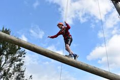 a person on a rope course in the air