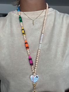 Customizable Rainbow 🌈 Crayon 🖍️ Lanyard - The perfect lanyard for a teacher! This lanyard is sturdy and can hold your ID badge and keys. It comes with one hook. The lanyard hangs between 16 - 18inches. If you need a specific length you can message me.  *These lanyards are not meant to be wet or go in water. Please be aware that if exposed to water, after a few occurrences, may begin to tarnish.* Due to the 7 silicone beads on this lanyard that is why the price is higher than my other lanyards Pre Service Teacher Gifts To Students, How To Make A Teacher Lanyard, Cute Teacher Lanyard, Diy Teacher Lanyard Beads, Teacher Lanyard Ideas, Diy Teacher Lanyard, Clay Bead Lanyard, Teacher Lanyard Beaded, Lanyard Diy