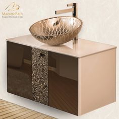 a bathroom sink sitting on top of a wooden counter next to a wall mounted faucet