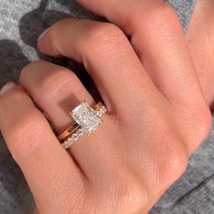 a close up of a person's hand with a ring on top of their finger