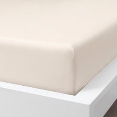 an image of a bed with white sheets