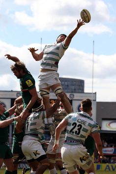 a group of men playing a game of rugby