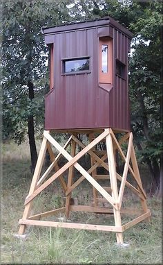 an outhouse in the middle of some trees