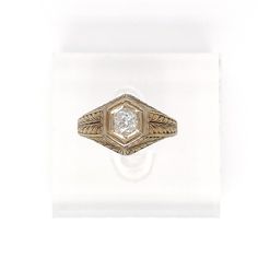 This is part of Chairish’s Fine Jewelry assortment.  A very fine antique engraved 14k gold and diamond ring.  With a lovely ca. 0.24 ct. Old European cut diamond (Color: G /Clarity: I1) set at the center of a hexagonal setting that is engraved with a feathered design to the band and shoulders.  Accompanied by a GEMLAB (Gemological Appraisal Laboratory) report.   Simply a wonderful ring!  Date: 20th Century  Overall Condition: It is in overall good, as-pictured, used estate condition with some ve Vintage Oval Engraved Diamond Ring, Antique Signet Ring For Anniversary, Antique Signet Ring With Diamond Accents For Formal, Heirloom Diamond Ring Stamped 14k, Vintage Engraved Diamond Ring For Formal Occasions, Classic Engraved Diamond Promise Ring, Engraved 14k Gold Diamond Ring In Fine Jewelry Style, Antique Engraved Rings For Formal Occasions, Formal Heirloom Engraved Ring Stamped 14k