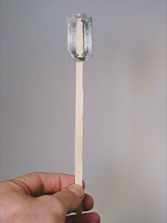 a person is holding a match stick in their hand