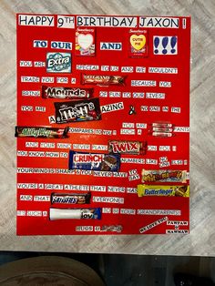 a red birthday card with lots of candy on it