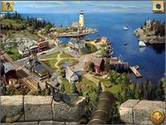 an aerial view of a small town with a lighthouse in the middle and boats on the water