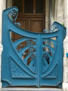 a blue door with an intricate design on it