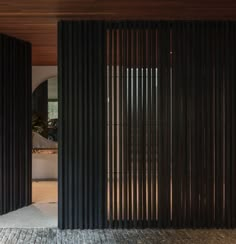 an open door leading into a room with wooden slats