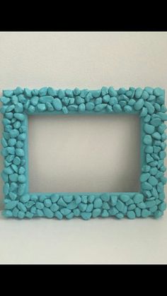 a blue frame with pebbles in it