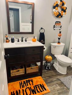 a bathroom decorated for halloween with decorations