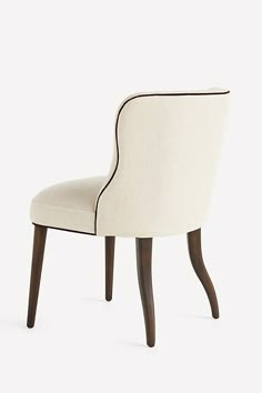 With a curved seat and back legs, this classic yet modern dining chair has a graceful silhouette that's as comfortable as it is elegant. For ordering assistance and more, please contact us For aesthetic advice and tips to help decorate your space, enjoy our complimentary home styling services | Meryl Linen Walnut Dining Chair by Anthropologie in Beige, Polyester/Cotton/Linen End Dining Chairs Different, Double Parlor, Aesthetic Advice, Wingback Dining Chair, Transitional Dining Chairs, Styling Services, Traditional Dining Chairs, Walnut Dining Chair, New Victorian