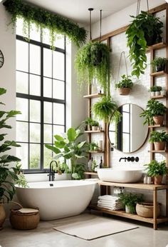 a white bath tub sitting next to a window filled with plants and potted plants