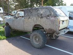 an old pick up truck is parked in a parking lot