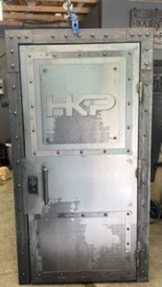 an industrial steel door is shown in this photo, and it appears to be being repaired