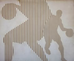 an image of a man holding a skateboard in front of a wall with stripes on it