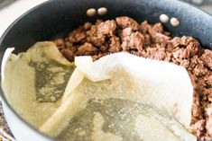 the food is being prepared in the pan