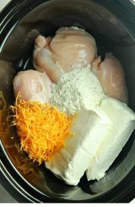 chicken, cheese and other ingredients in an electric pressure cooker