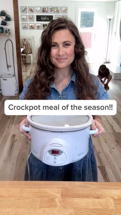 a woman holding an electric pressure cooker with the words crockpot meal of the season