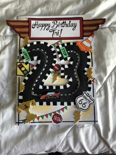 a birthday card with the number twenty five on it, and a train track in the middle