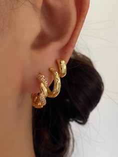 Simply Elegant, gold twisted pave hoop earrings crafted with premium 18k gold electric plated offering a distinctive deep gold colour, these earrings work wonders for your everyday wear or they will be stunning for your bridal party. • Material: 18k Gold Plated on brass• Size: 16mm x 16mm• Safe for sensitive skin• Hypoallergenic, lead and nickel-free• Sold as a pair ♡ Have any questions or need advice on your order? Feel free to contact us. We are fast to reply. ♡ All orders are going out next b Two Gold Hoop Earrings, Gold Hoop Stack Earrings, Gold Elegant Earrings, Gold Hoop Earring Stack, Bold Gold Earrings, Gold Hoop Stack, Prom Gold Jewelry, Earing Stack Gold, Earring Inspo Gold