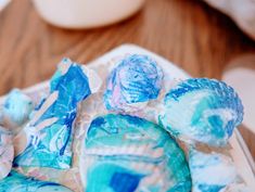 some blue and white candies are on a plate