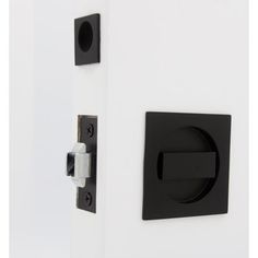 the door handle is black and white with a square design