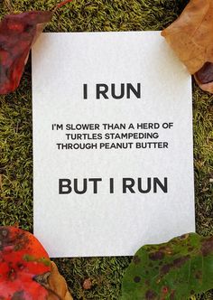 a piece of paper that has been placed on the ground with leaves around it and an i run sign