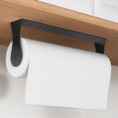 a roll of toilet paper is hanging on the wall