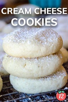 three sugary cream cheese cookies stacked on top of each other