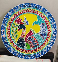 a colorful plate sitting on top of a table