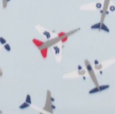 an image of airplanes flying in the sky with red, white and blue markings on them