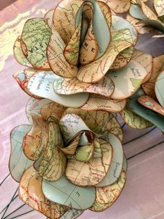 a bunch of paper flowers sitting on top of a table