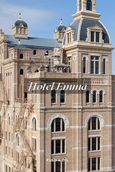 an old building with a clock tower on top and the words hotel finnna above it