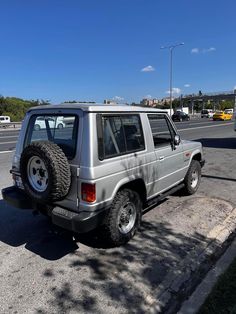 an suv parked on the side of the road with its tire stuck in it's tires