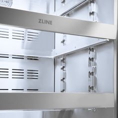 an open stainless steel refrigerator with the door and shelves showing it's freezer