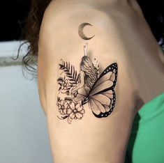 a woman's shoulder with a butterfly and flowers tattoo on her left side arm