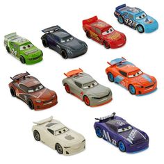 a group of toy cars sitting on top of each other in different colors and shapes