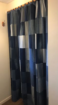 a black and white checkered shower curtain in a bathroom