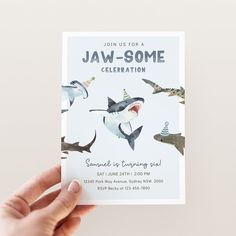 someone is holding up a card with shark pictures on it and the words jaw - some celebration