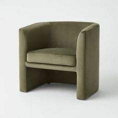 an olive green chair with curved legs