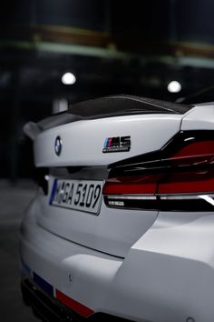 the back end of a white bmw car