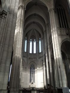 the interior of a large cathedral with tall columns