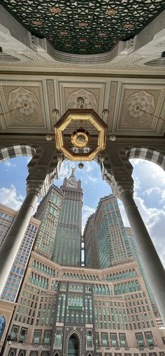 the view from below looking up at two tall buildings