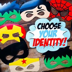 some paper masks that are on top of a wooden board with the words choose your identity