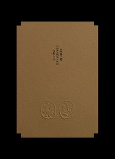 the front and back cover of a book with two faces on it, in brown paper