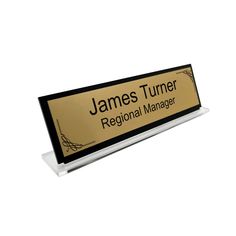 a sign that says james tumer regional manager on it's white and black base