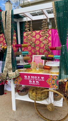 a vendor cart with various items for sale